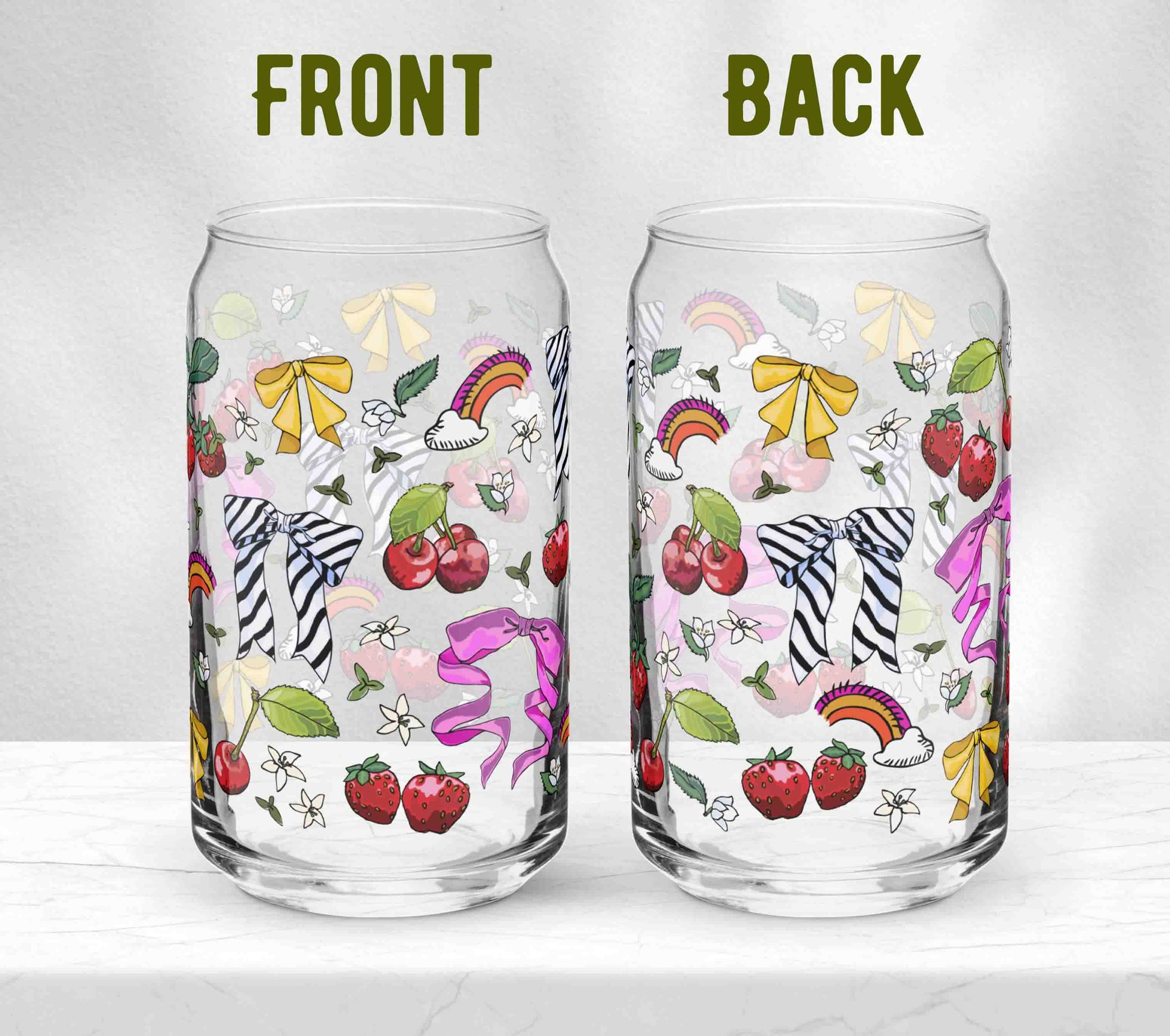 Two glasses sitting on marble. Each one is turned in a different direction to show the front and the back of the design.