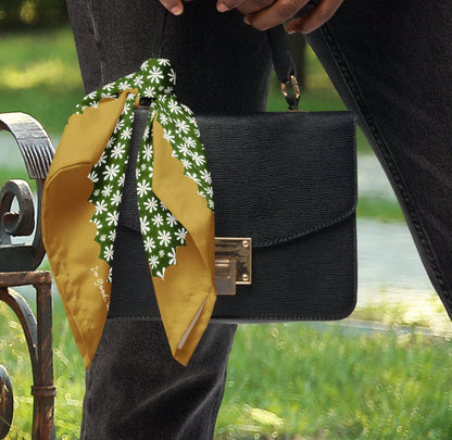 This is a photo of the Daisy Flower bandana scarf styled as a purse accessory.
