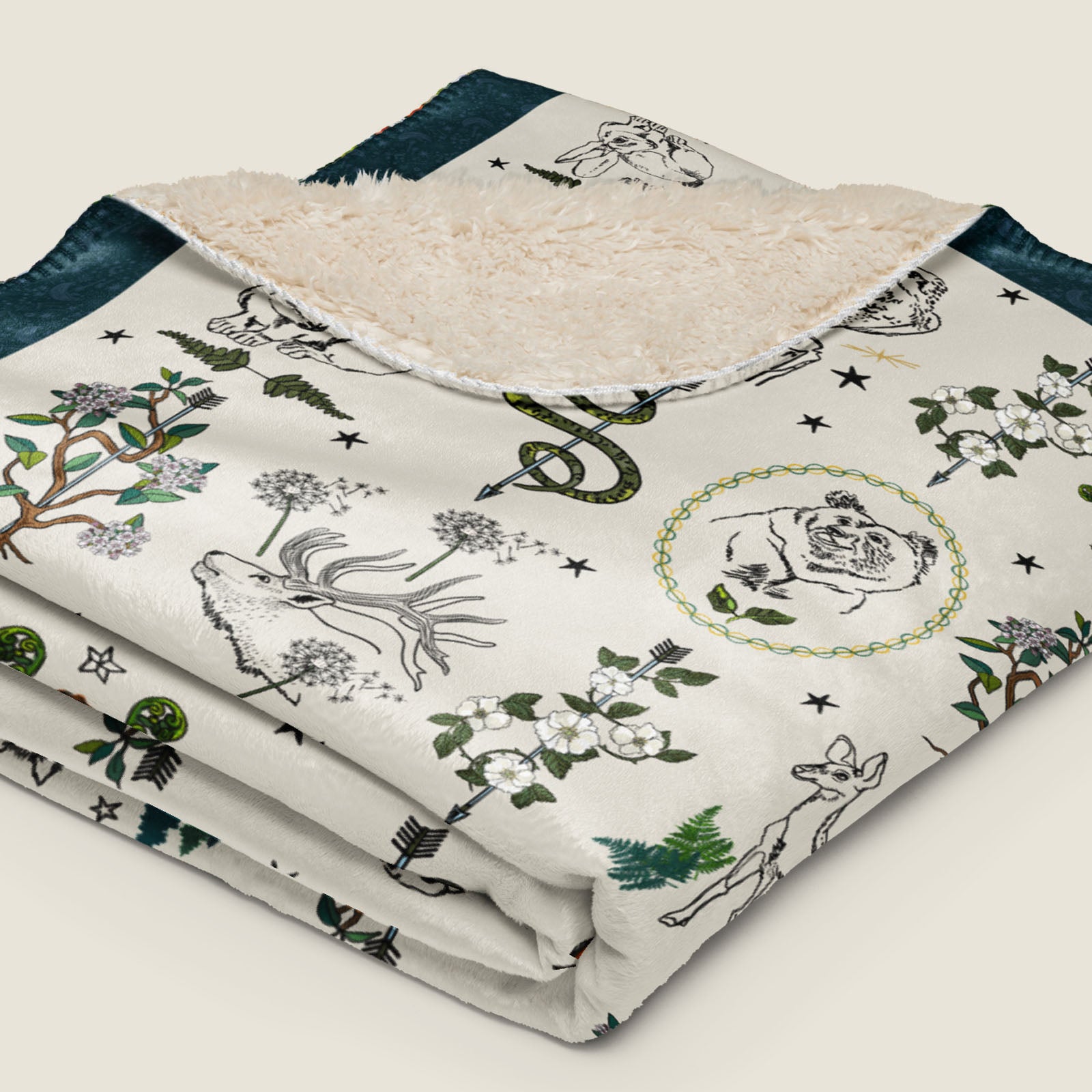 Fierce, Feral, and Free Faux Fur Sherpa blanket folded and laying on an ivory background.