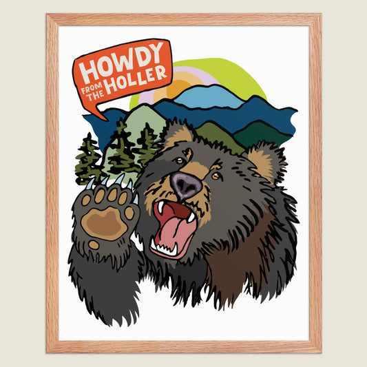 Framed artwork of an illustrated bear in the Appalachian mountains and 'Howdy from the Holler' text. 