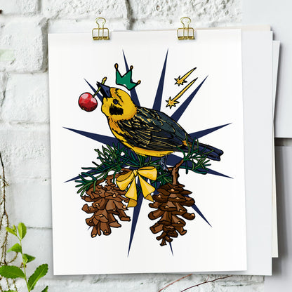 Gold Finch art print hanging from a white bring wall with gold clips.