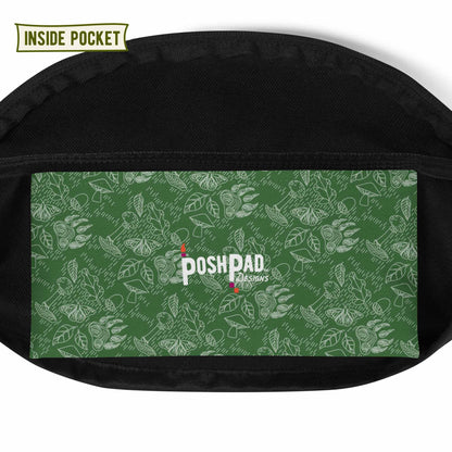 View of the inside pocket. It has a white pattern of bear paws, mushrooms, butterflies, and leaves on a green background. The Posh Pad logo is in the middle.