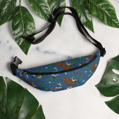 Bird hip pack on a marble table surrounded by leaves.