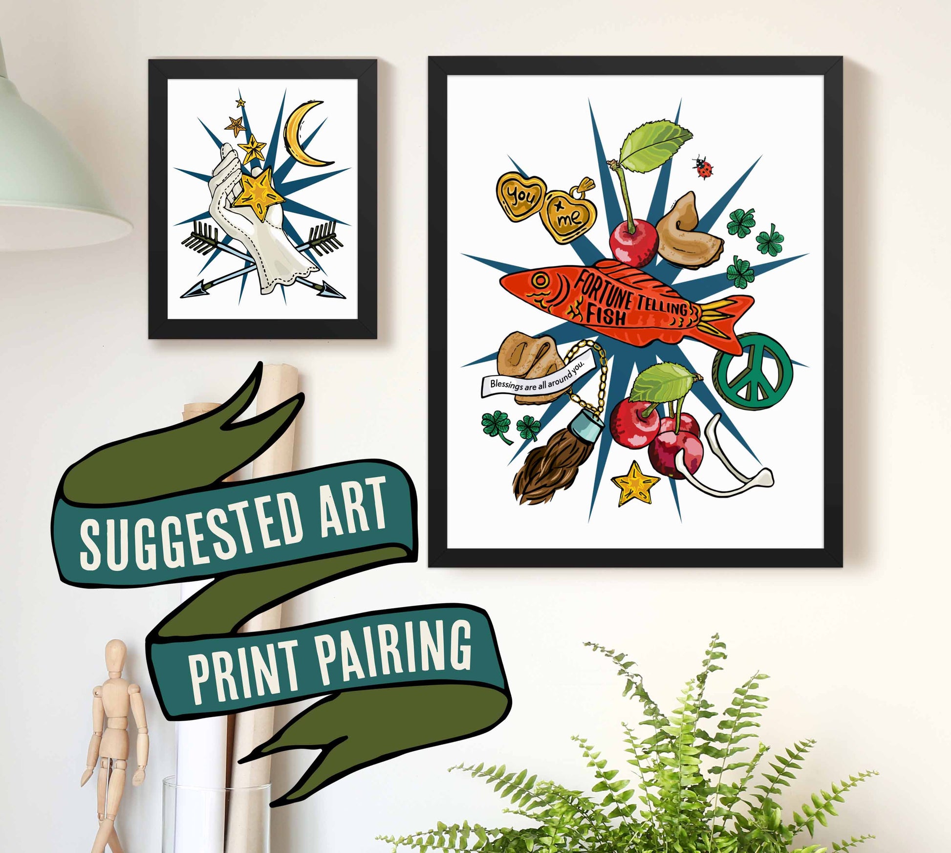 This is a photograph of two framed art prints from the Posh Pad Appalachian Rococo collection with a ribbon stating that this is a suggested art print pairing. The two prints in the photo are the Lucky Star & Crescent Moon paired with the Good Luck Charms Fortune art print.