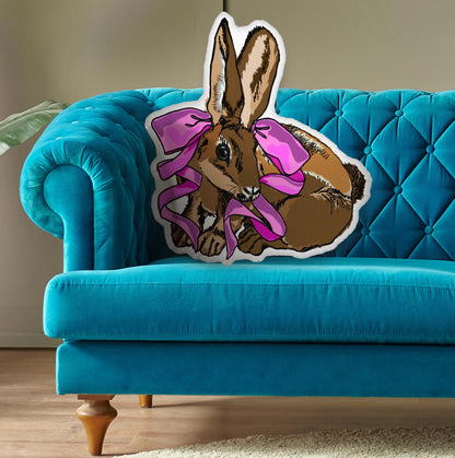 This is a photo of the shaped pillow on a blue couch.