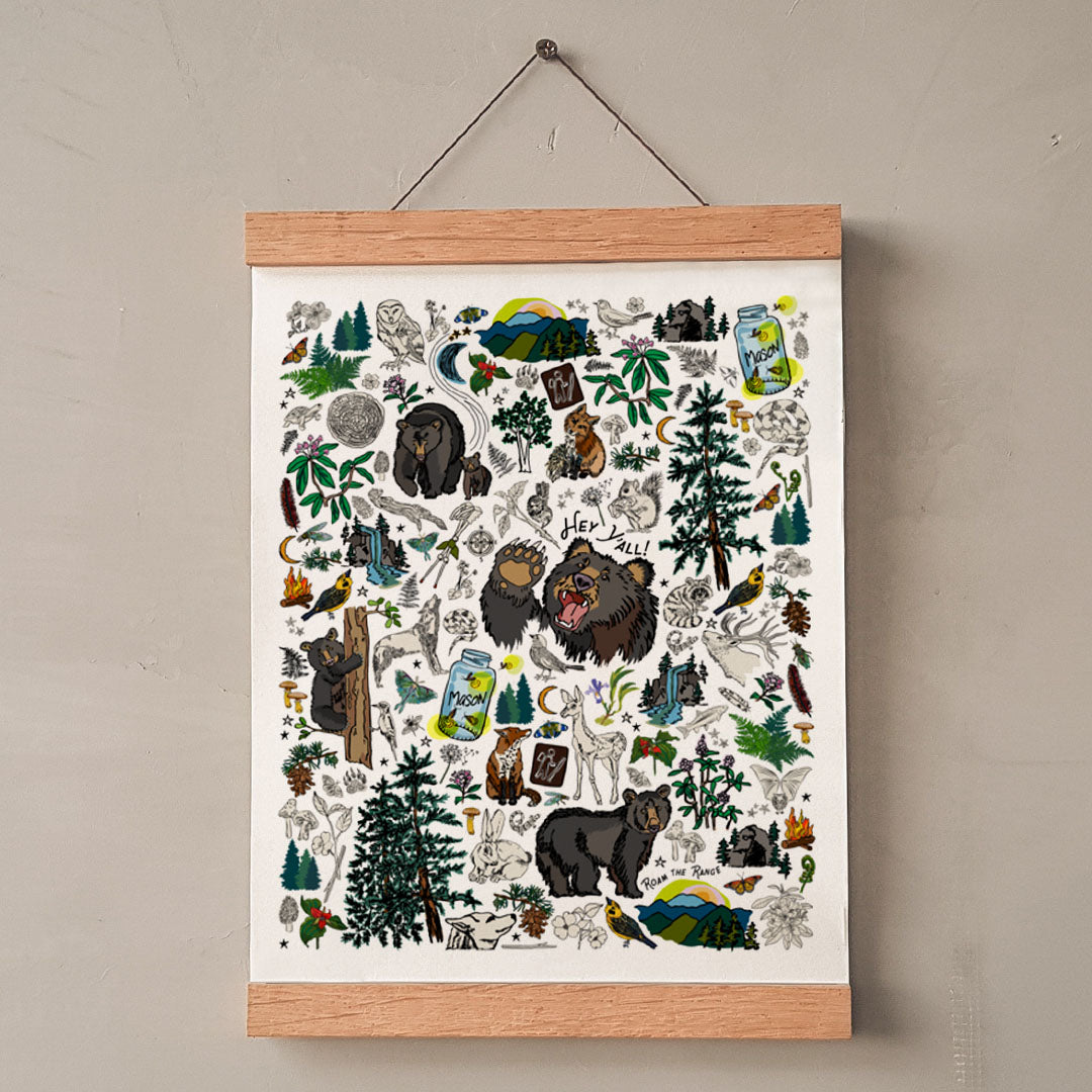 Mountain Hikes art print hung with wooden wall display strips.