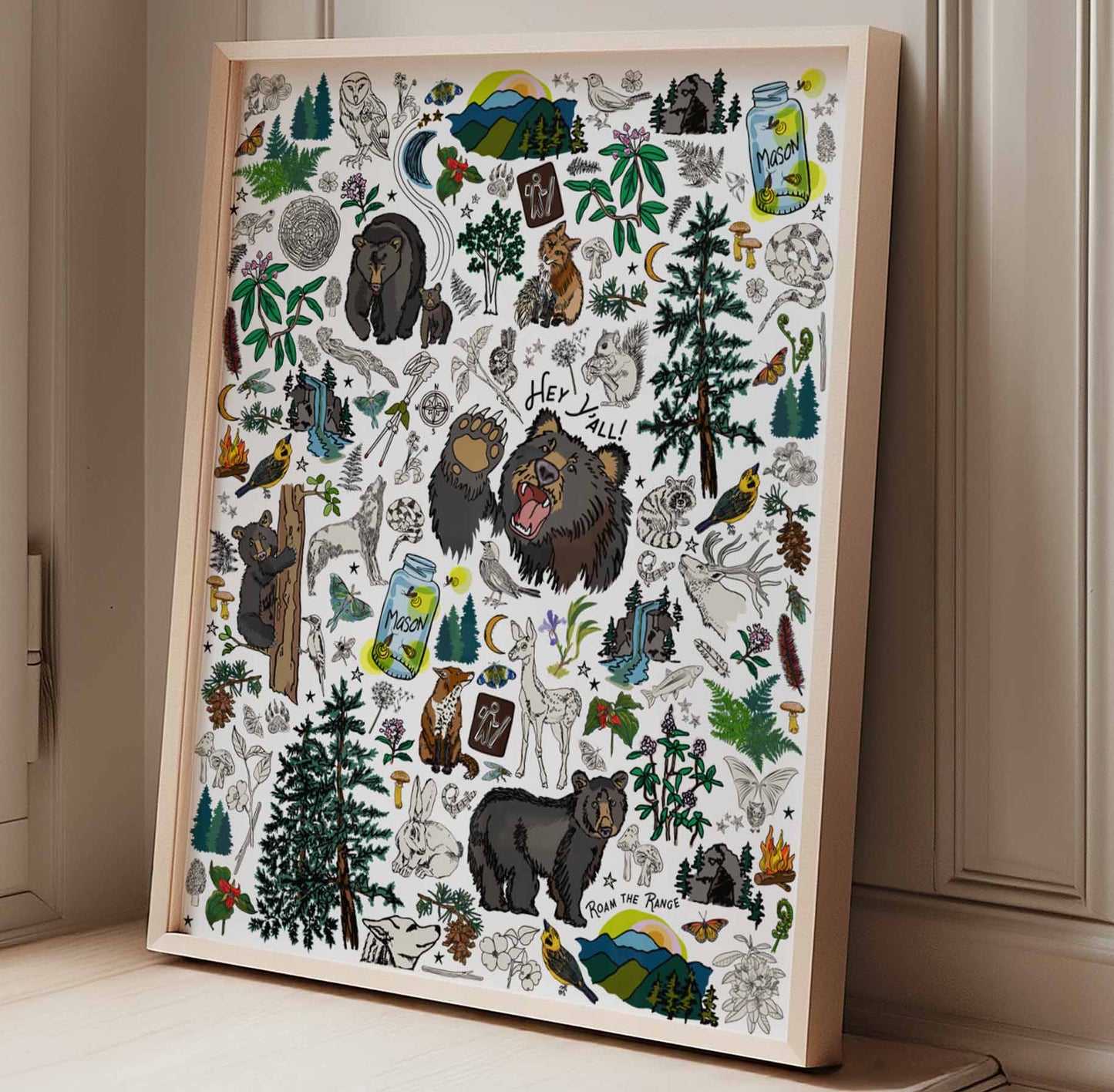 The Mountain Hikes art print poster framed in a natural wood frame sitting by a window.