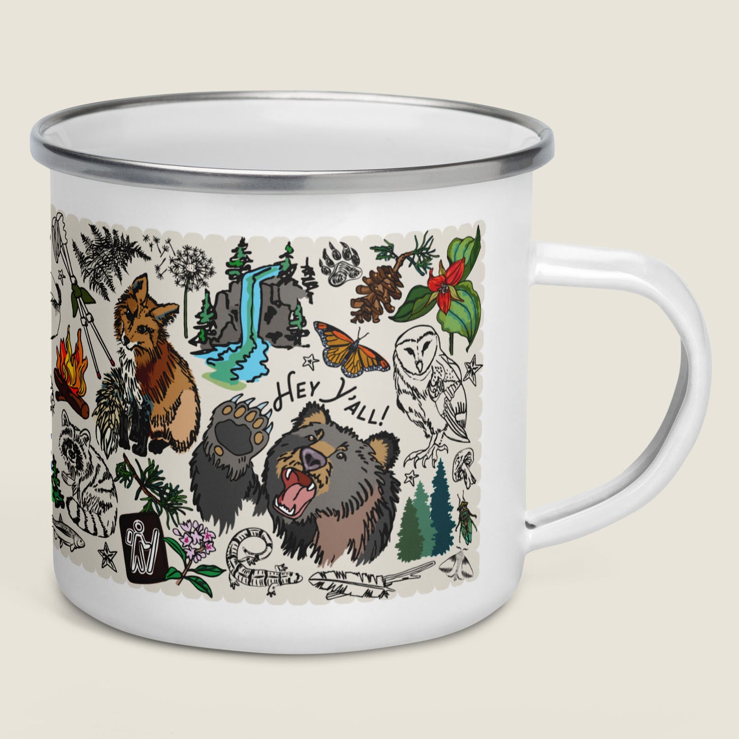 Mountain Hikes enamel camp mug with nature-themed illustrations on an ivory background.