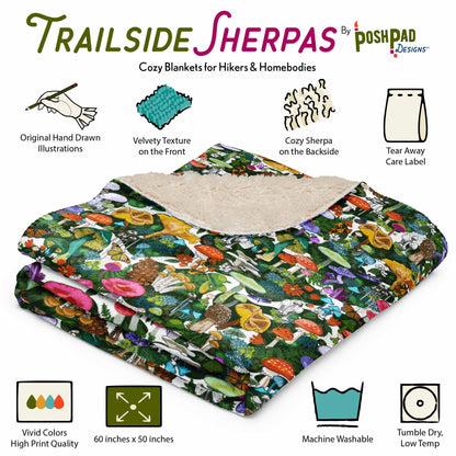 Folded blanket with mushroom-themed design, surrounded by illustrations of the blanket's features for the Trailside Sherpas brand. The features include original hand-drawn artwork, velvety textured front side, fluffy sherpa texture on the backside, tear-away tag, vivid printing, size is 60 x 50 inches, machine washable, and tumble dry on a low temp setting.