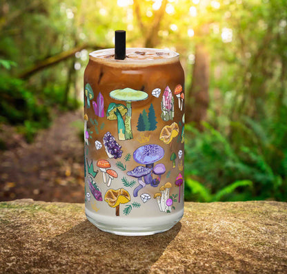 This is a photo of the glass containing an iced latte. It's sitting on a rock in the woods.