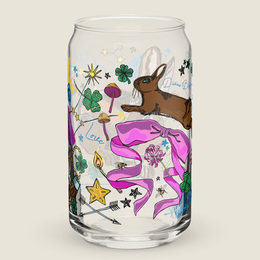 The Orion Constellation glass tumbler on an ivory background. The artwork on the glass is an illustration of the Orion Constellation, which holds the "Three Lucky Stars", long considered to symbolize prosperity, longevity, and happiness. The illustration includes lucky rabbits, four-leaf clovers, mushrooms, stars, a crescent moon, burning matches, bows and arrows for loyalty, and other symbols of good fortune. The color palette is primarily golden yellows, pinks, forest greens, and vibrant blues.