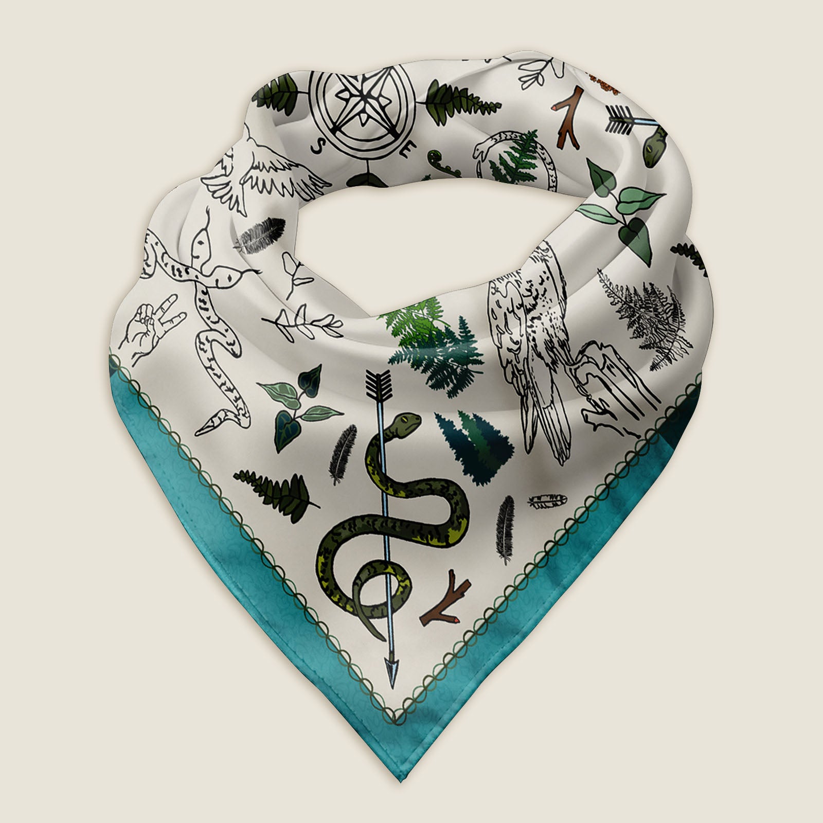 The Peace Out in the Woods bandana scarf folded into a triangle and laying on an ivory background. This view shows a close up of the hand-drawn illustration. The artwork has snakes wrapped around arrows and other poses, birds, ferns, pinecones and feathers surrounding a compass in the middle.