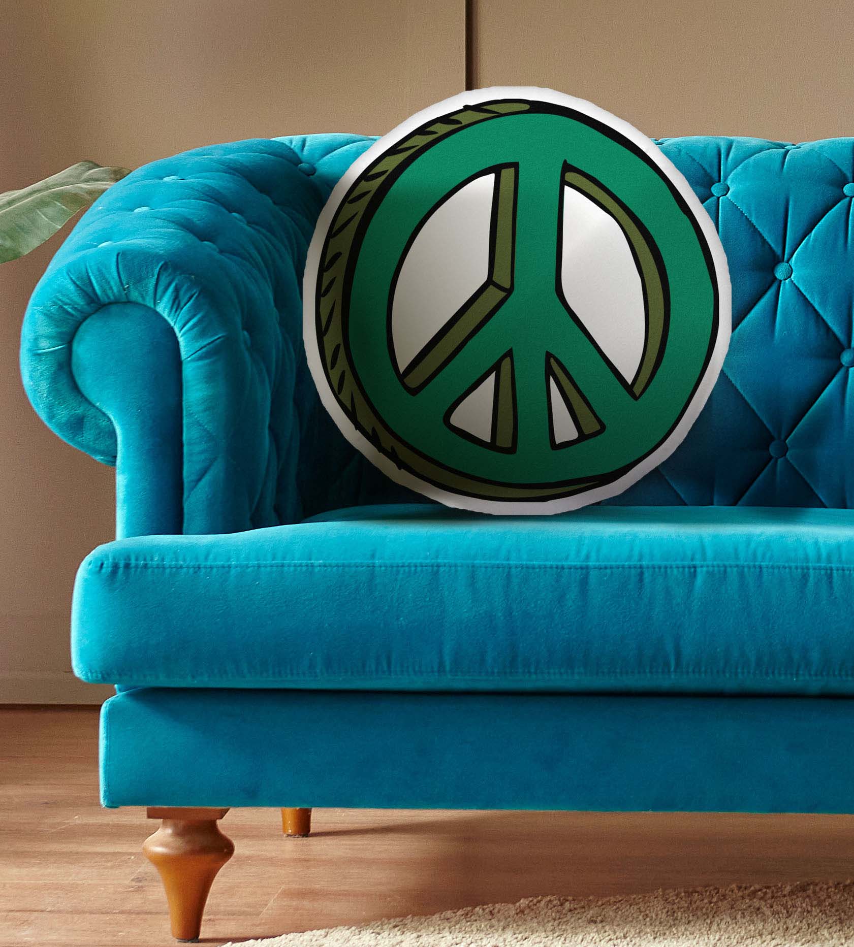 This photo shows the pillow on a bright blue couch.