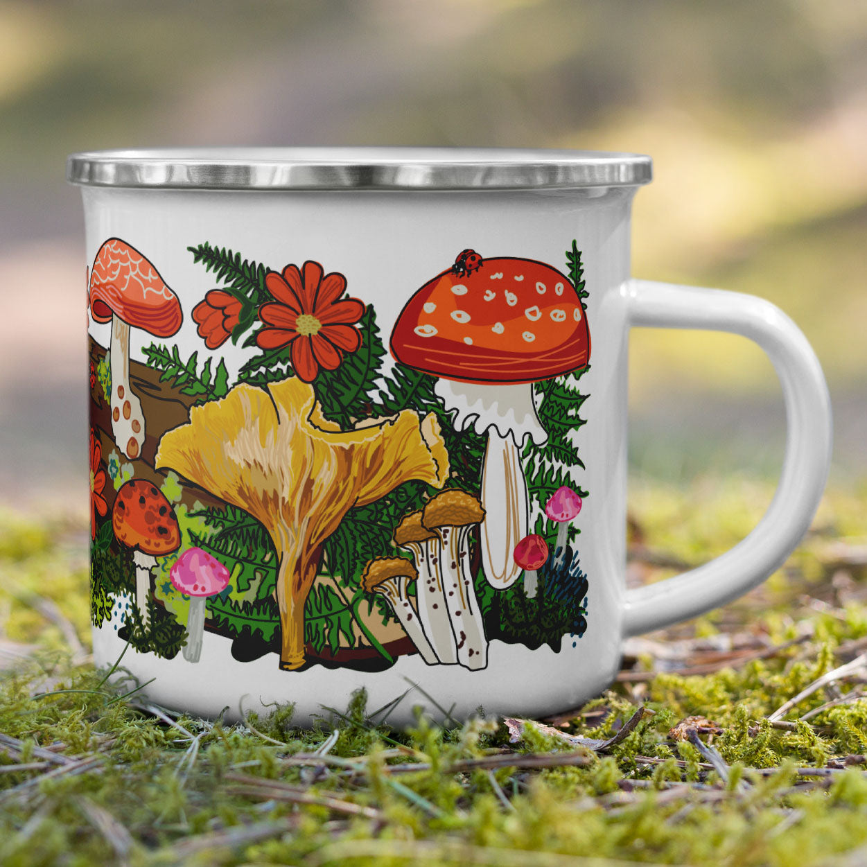 Red mushroom camp mug on moss.