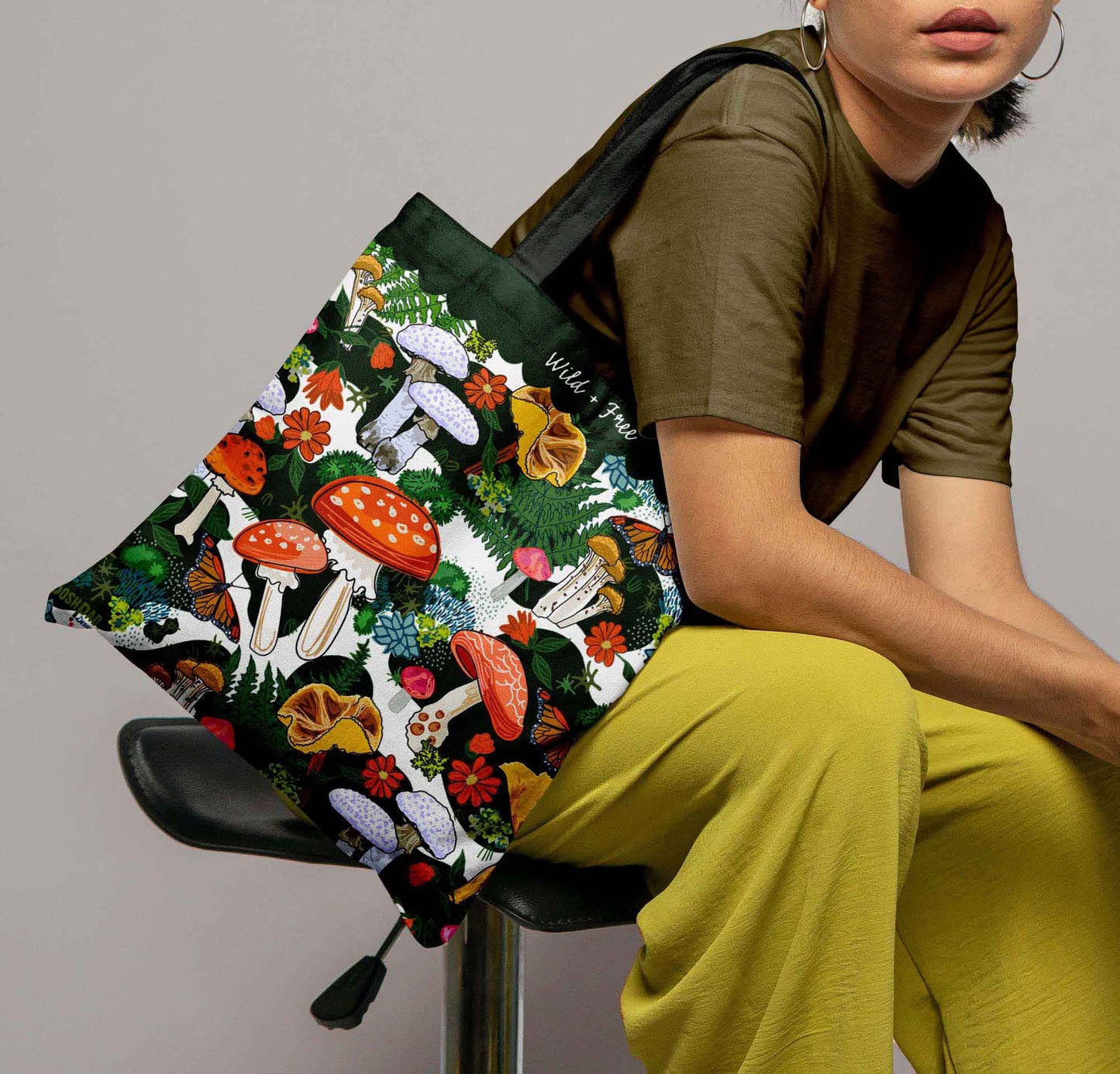 This is an image of a woman with the tote bag on her shoulder to show proportions.