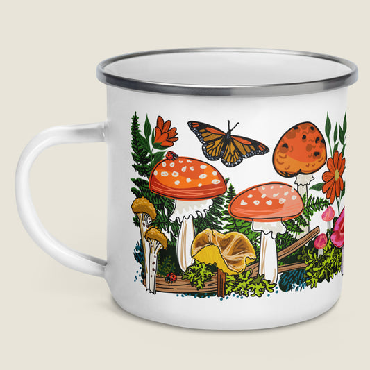 Red mushroom enamel mug on ivory background.