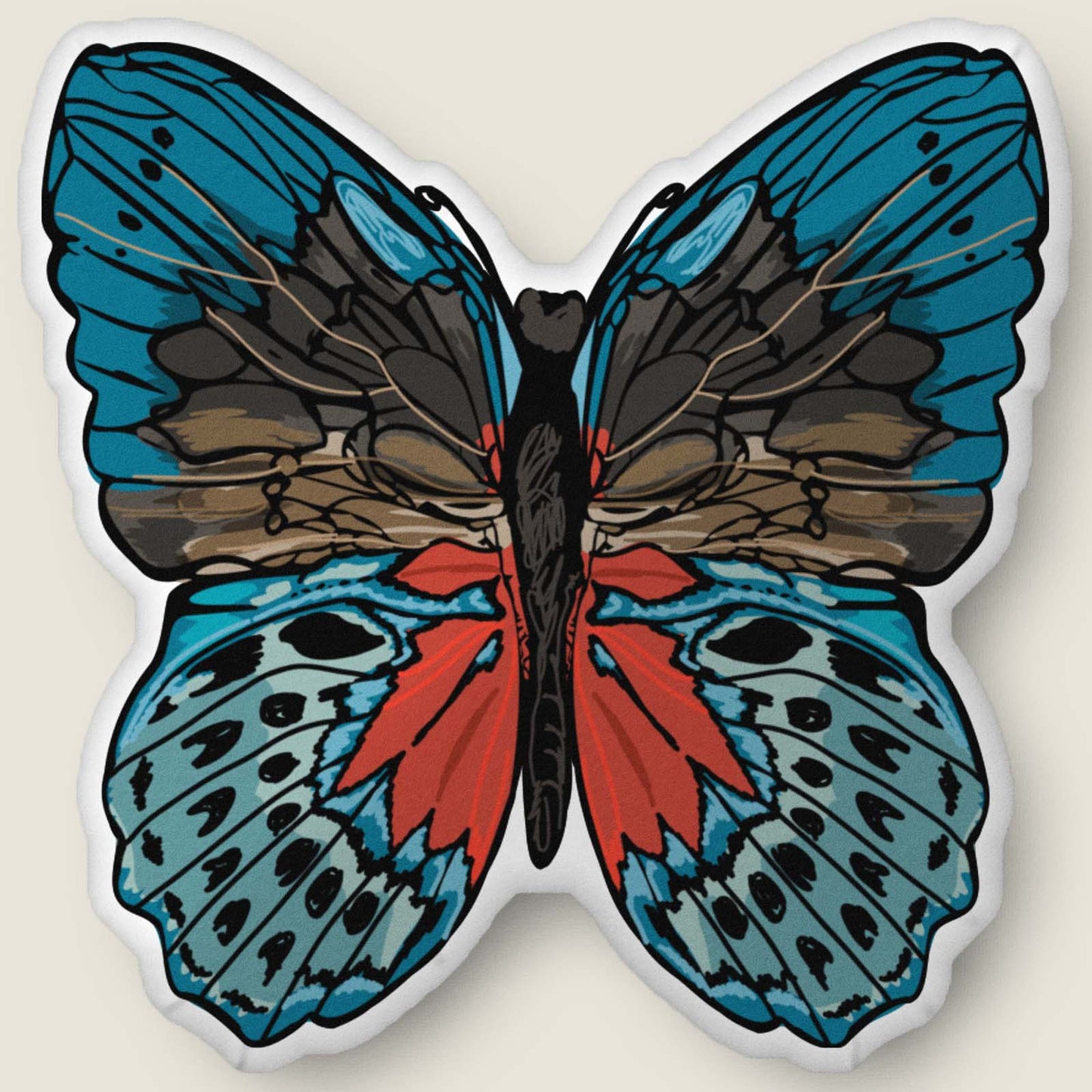 ​​A velvety, plush butterfly-shaped pillow in rich red and blue tones rests against an ivory background. Hand-drawn bohemian details and soft, sculpted texture make this cozy accent feel both artistic and nature-inspired.