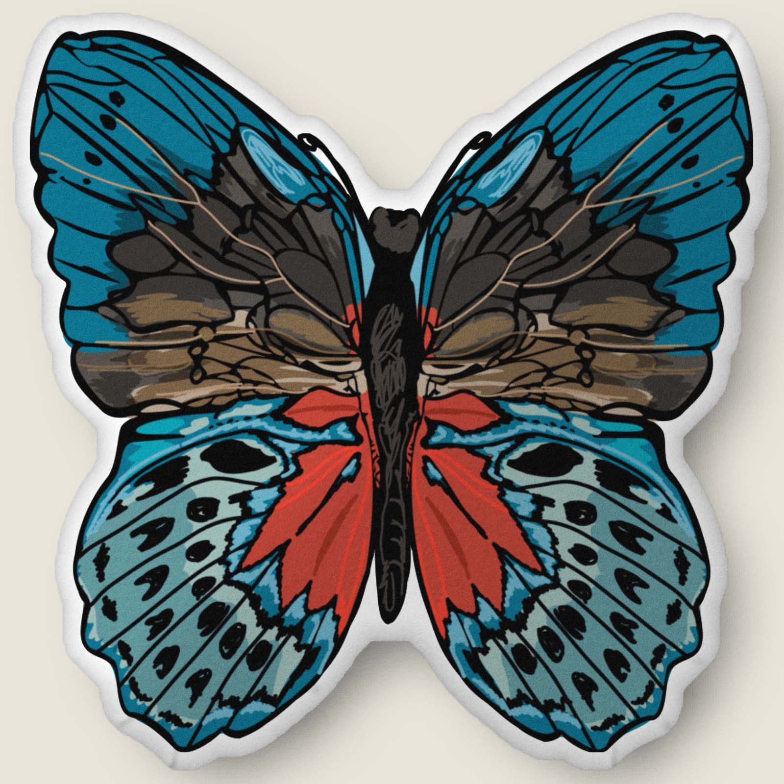 ​​A velvety, plush butterfly-shaped pillow in rich red and blue tones rests against an ivory background. Hand-drawn bohemian details and soft, sculpted texture make this cozy accent feel both artistic and nature-inspired.