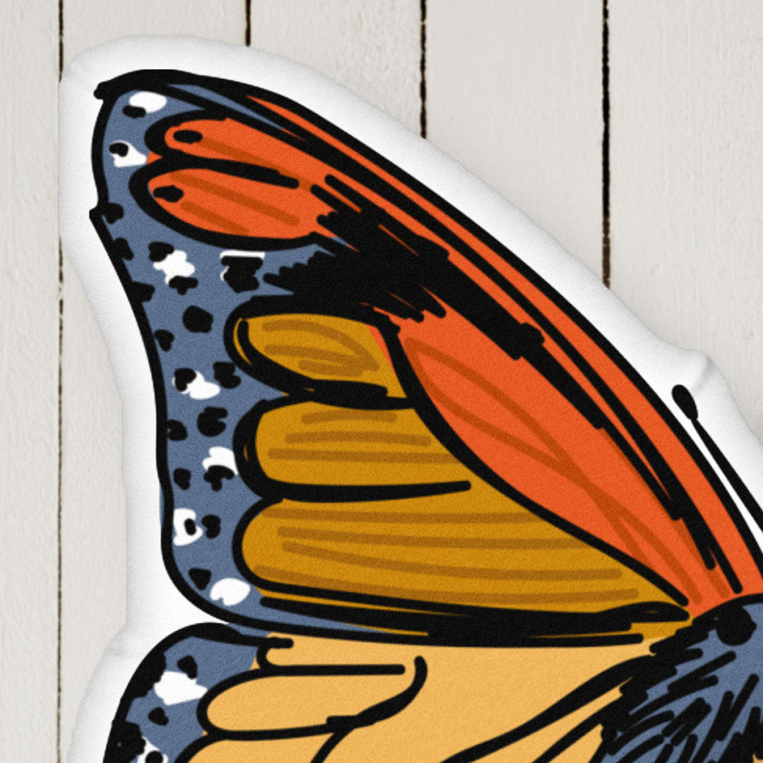 This image is a close-up of the Red and Blue Bohemian Butterfly pillow in the collection. It shows the velvety texture of all the pillows.