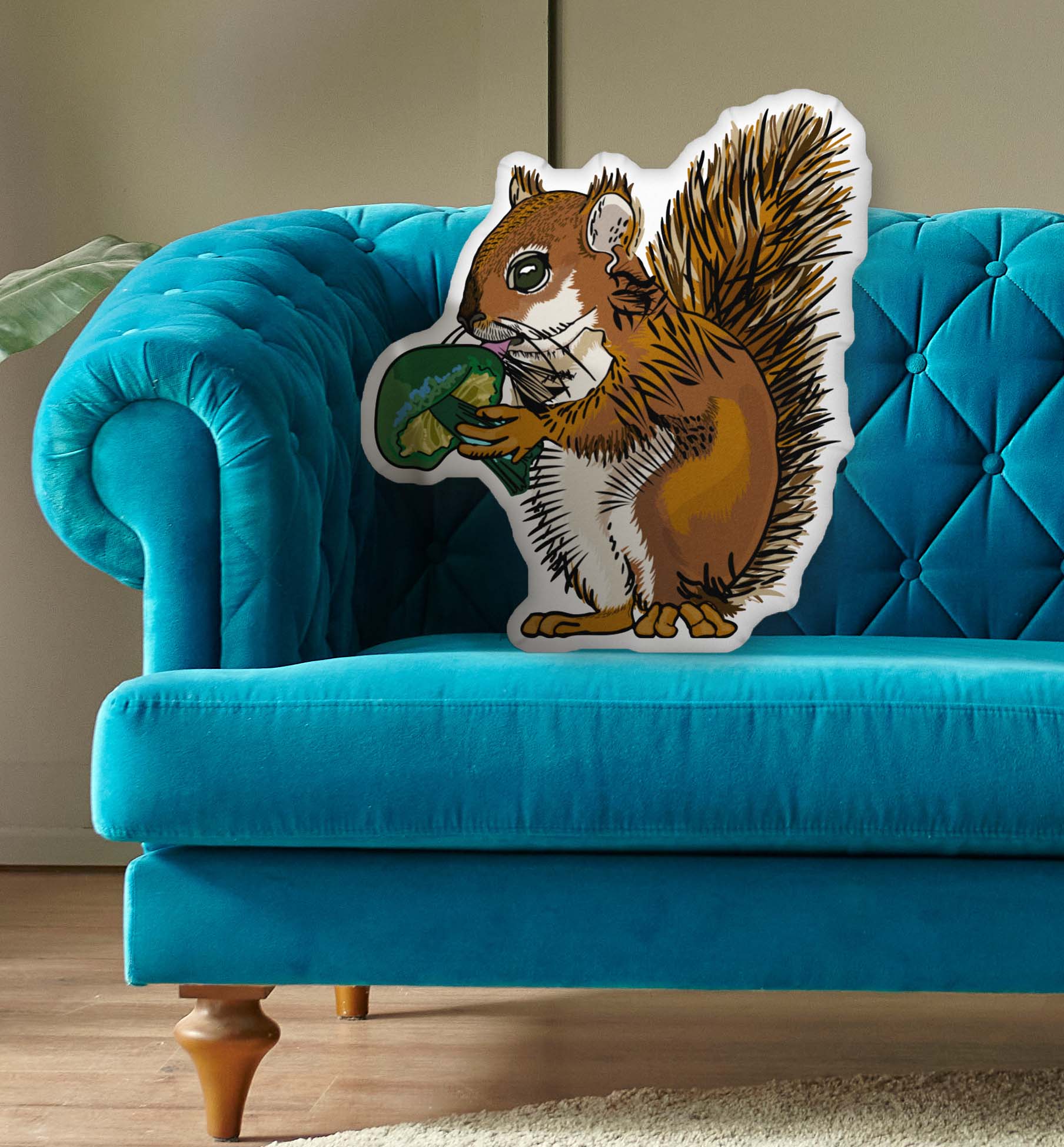 This is a photo of the shaped pillow on a blue couch.