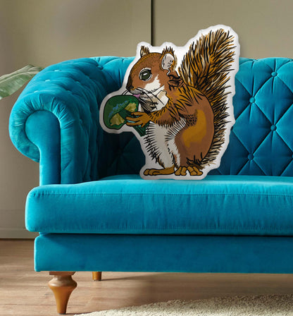 This is a photo of the shaped pillow on a blue couch.