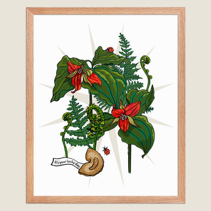 Red trillium flowers, ferns, and fortune cookies art print in a natural wood frame.