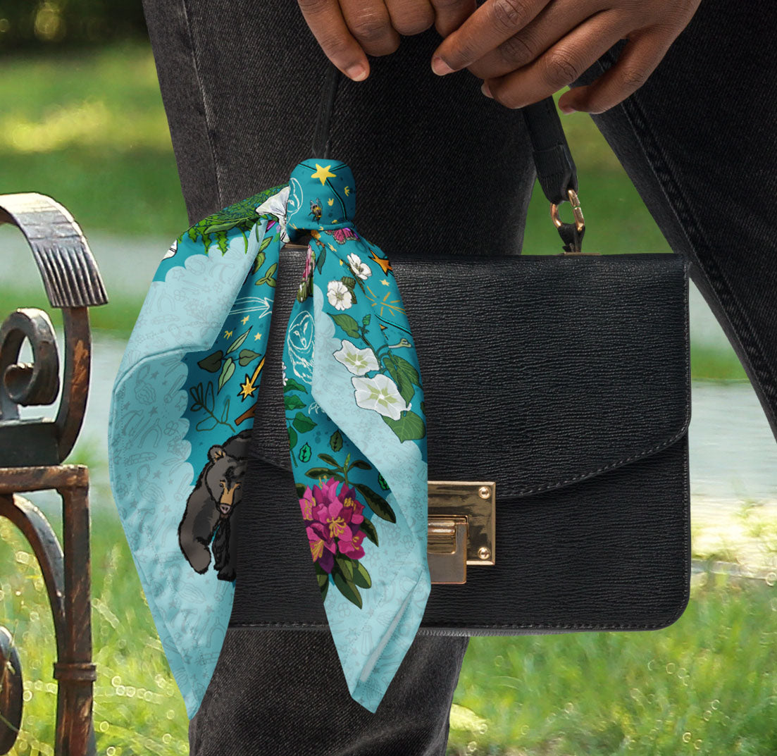 Ursa Major & Minor Stars Bandana styledon a black purse.