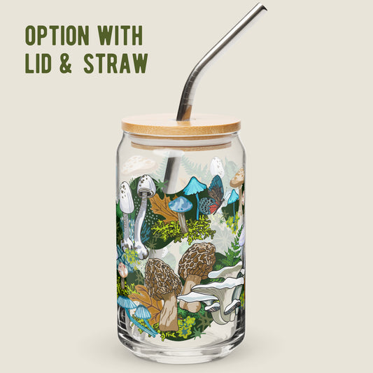 White Mushrooms glass tumbler with the lid and straw option on an ivory background.  The artwork on the glass is illustrations of various white, blue, and brown mushrooms, leaves, and moss, alongside blue and red butterflies. The color palette is primarily white, blues, browns, and mossy greens with accents of red.