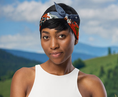 This is an image of a woman wearing the bandana as a headband. There is a mountain view behind her.