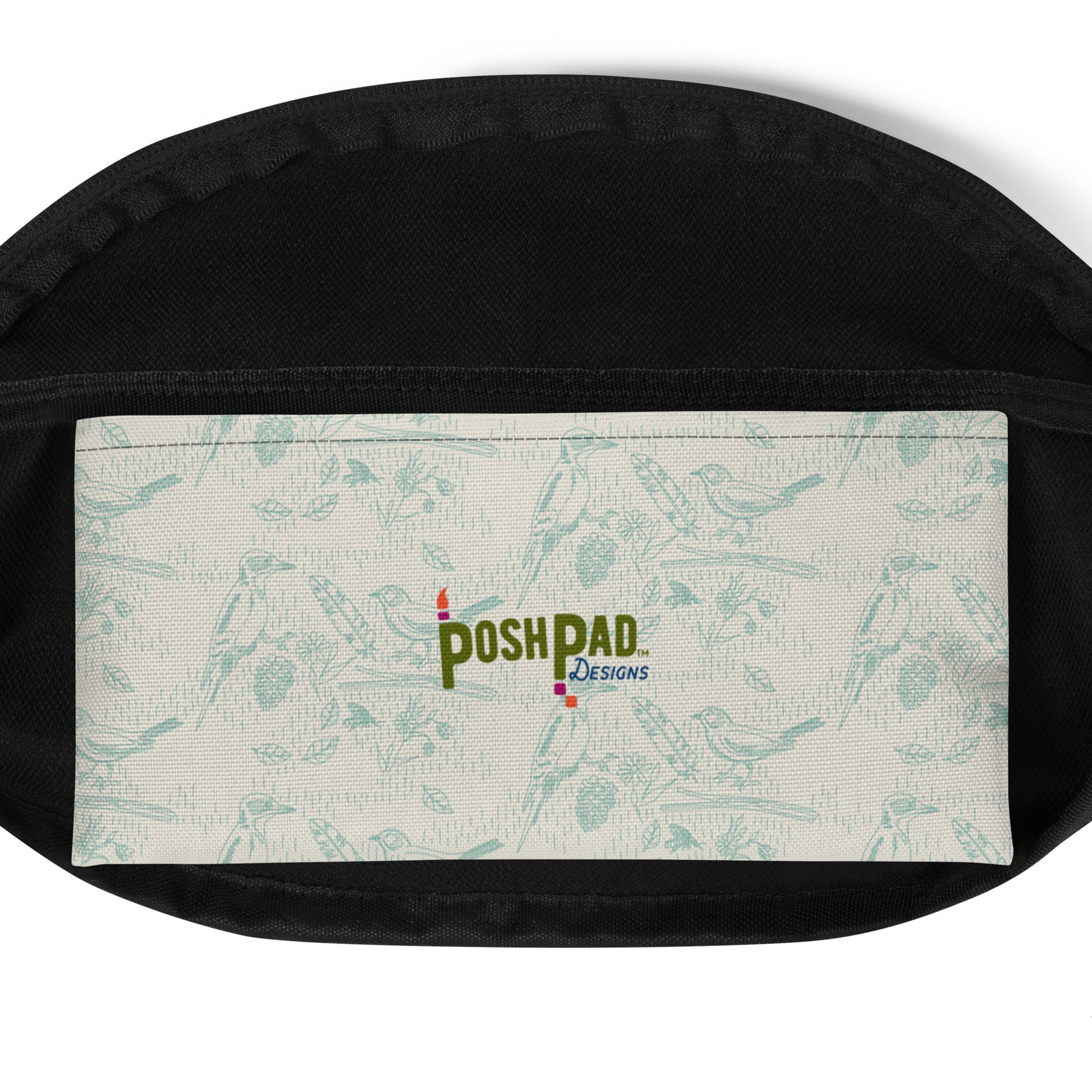 Interior pack pocket. It has a blue bird and feather pattern with the Posh Pad logo in the middle.