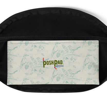 Interior pack pocket. It has a blue bird and feather pattern with the Posh Pad logo in the middle.